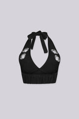 Deep V neckline halter bra top with large metal grommet details
