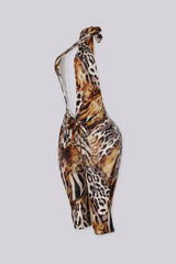 Leopard print halter jumpsuit with a deep plunge neckline and fluid drape
Open back design with adjustable tie neck closure