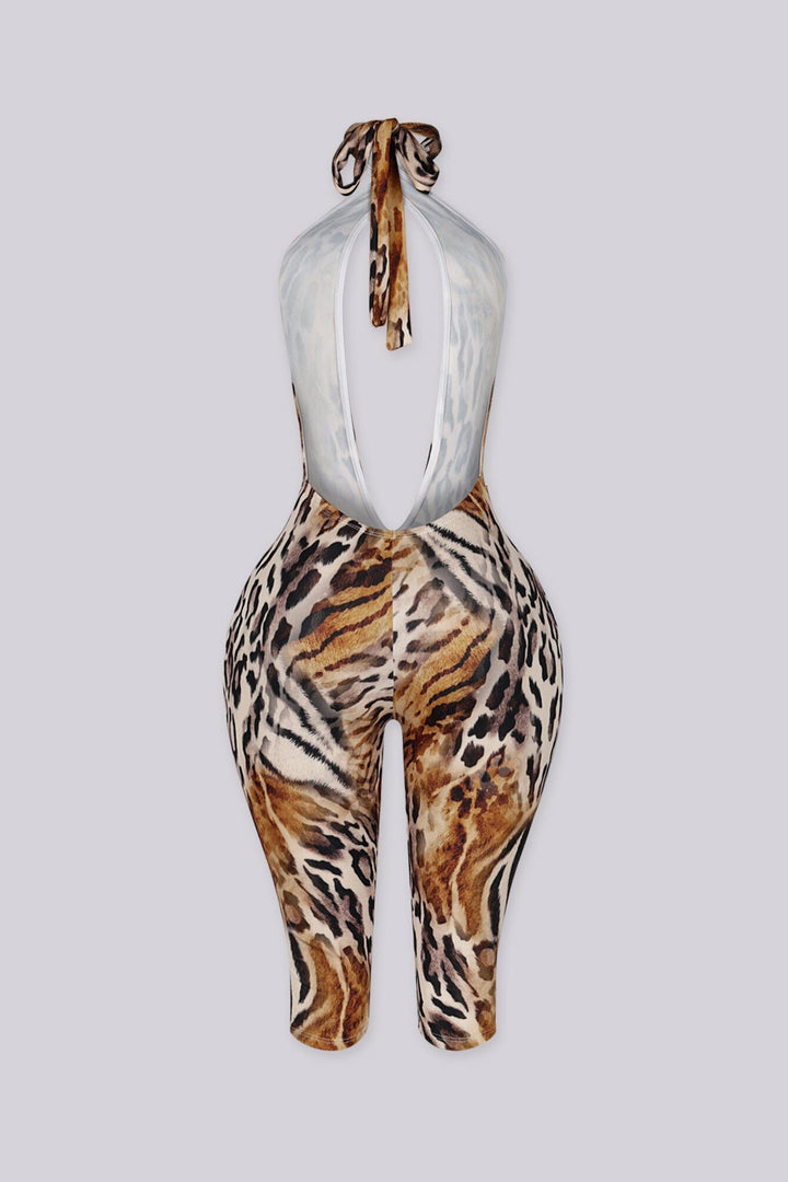 Leopard print halter jumpsuit with a deep plunge neckline and fluid drape
Open back design with adjustable tie neck closure