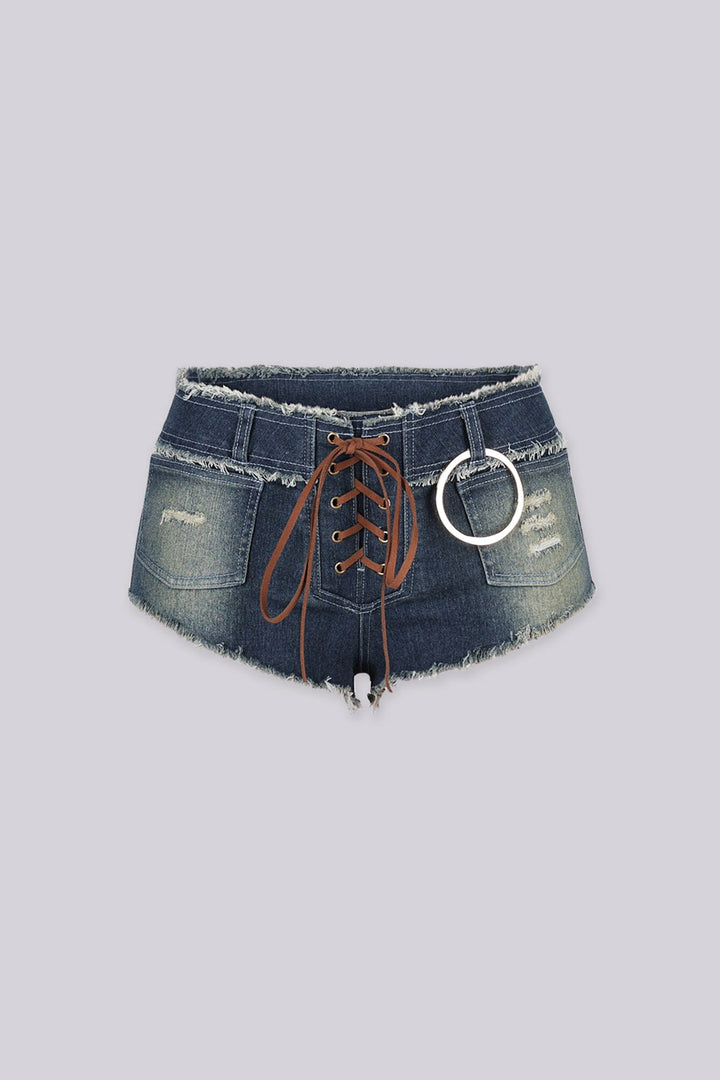 Ultra low rise distressed denim shorts featuring lace up details and sliver O ring hardware