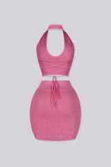 knit halter crop top with deep V plunge neckline featuring crisscross lace up eyelet closure
Matching high waisted bodycon mini skirt with wide elastic waistband