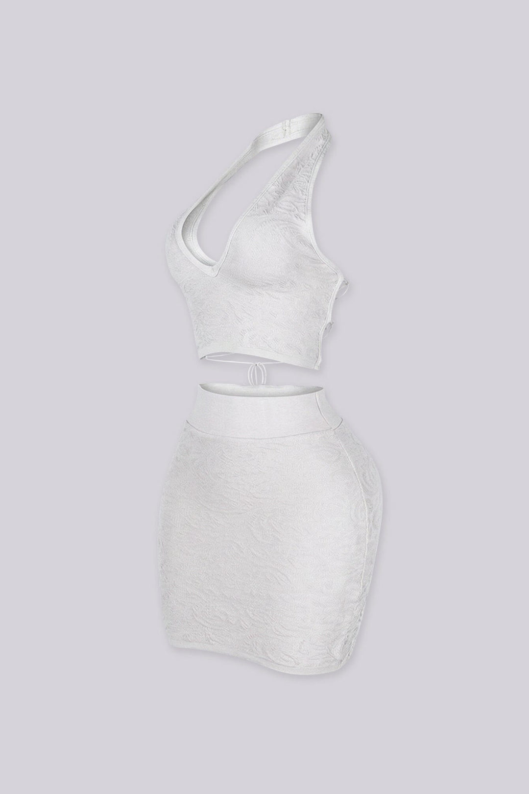 knit halter crop top with deep V plunge neckline featuring crisscross lace up eyelet closure
Matching high waisted bodycon mini skirt with wide elastic waistband