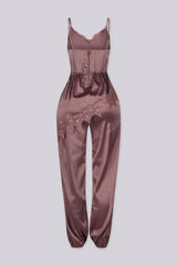 Satin lingerie inspired jumpsuit with thin straps featuring lace trimmed neckline and bodice