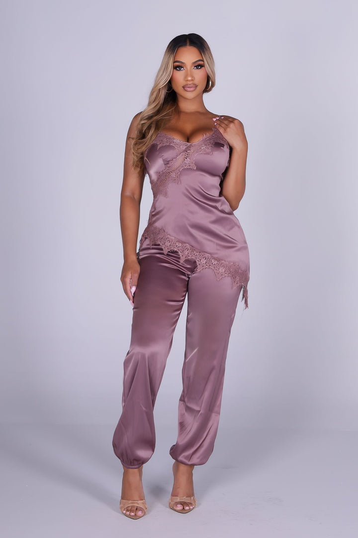Satin lingerie inspired jumpsuit with thin straps featuring lace trimmed neckline and bodice