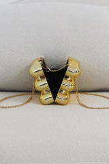 EDGE — gold bubble-textured mini clutch shown open from the back, flat lay