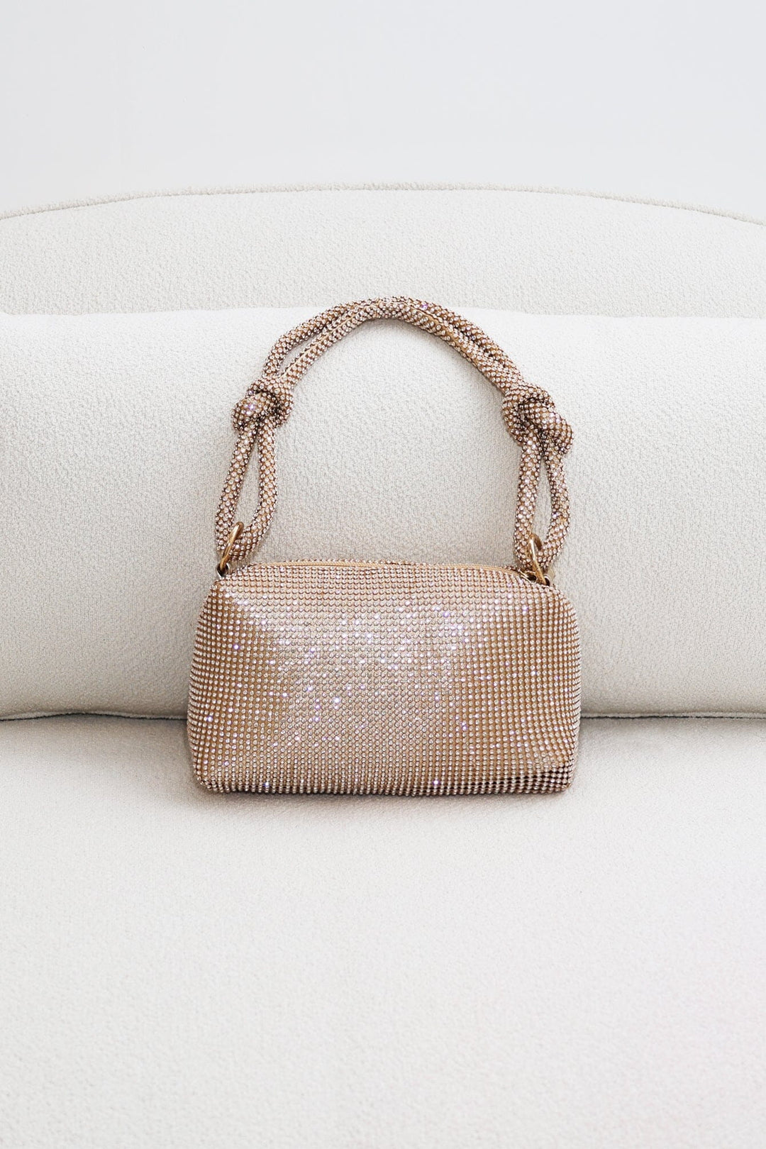 EDGE — gold rhinestone-embellished top handle evening bag, front view flat lay