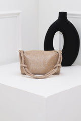 EDGE — gold rhinestone-embellished top handle evening bag styled on a pedestal