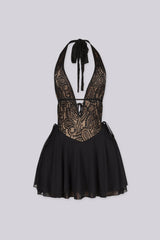 Halter mini dress featuring a deep v neckline, Nude illusion lace bodice, Flowy ruffled skirt and an open back with adjustable string ties