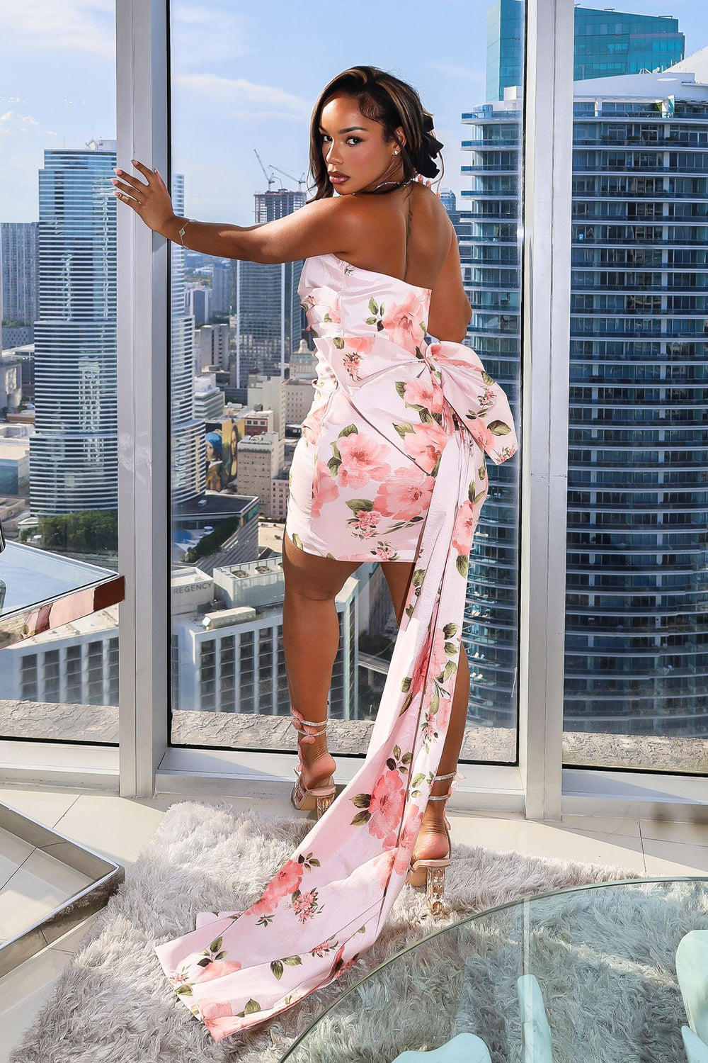Floral satin mini dress with ruched front,
Oversized statement bow at the back