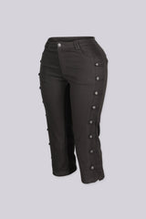 High rise capri denim pants with rows of decorative button trim running down each outer leg seam