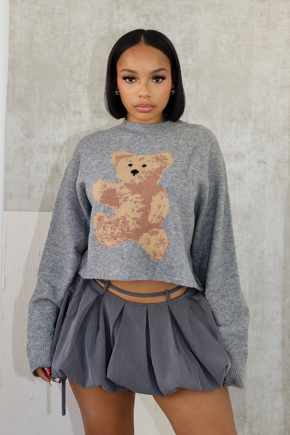 Long sleeve mock neck sweater top featuring bear graphic