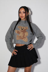 Long sleeve mock neck sweater top featuring bear graphic