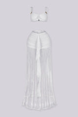 Bralette crop top featuring a gold hardware bralette,
Matching set with ruched mini skirt with floor length fringe