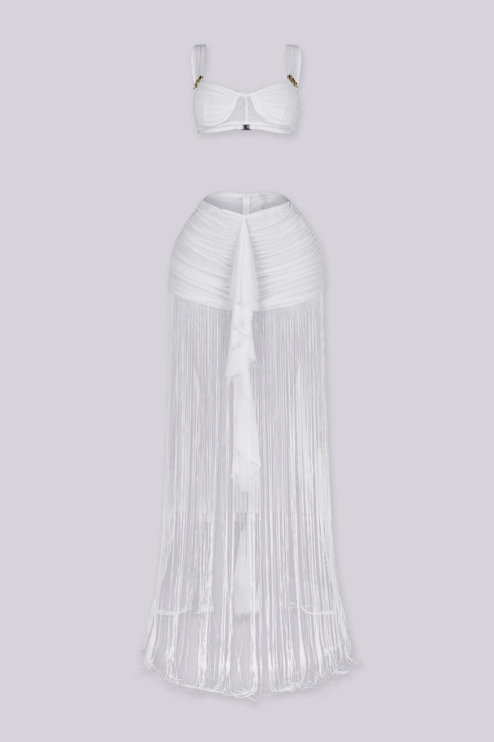 Bralette crop top featuring a gold hardware bralette,
Matching set with ruched mini skirt with floor length fringe