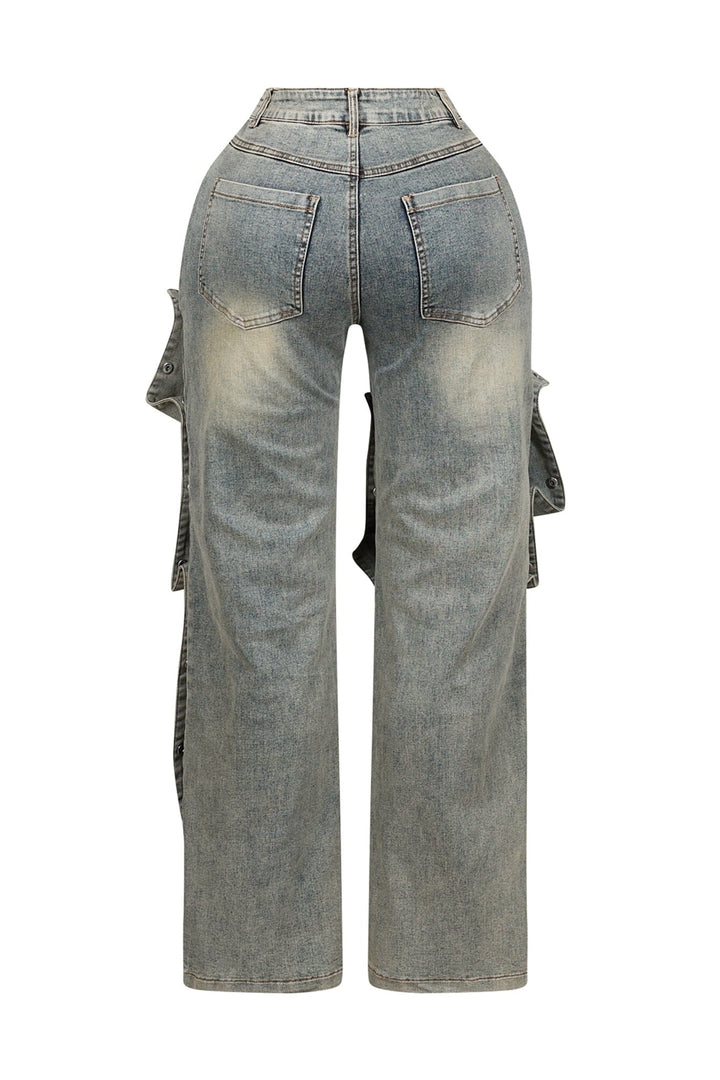 High waist wide leg jeans featuring multiple overlapping fabric flaps with metallic snap buttons