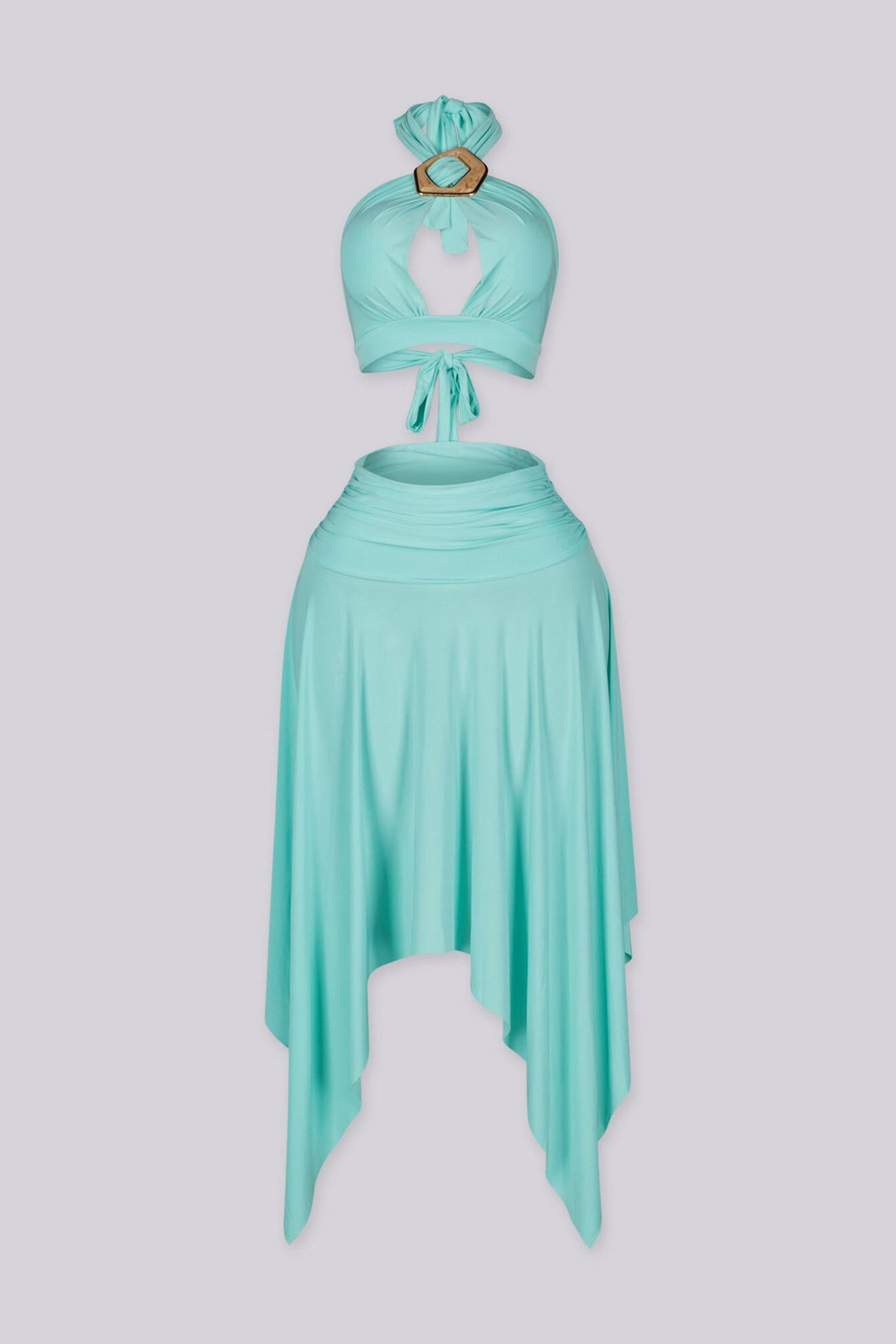 Halter bra top with sculptural metal trim and flowy pixie skirt with an asymmetrical hemline
