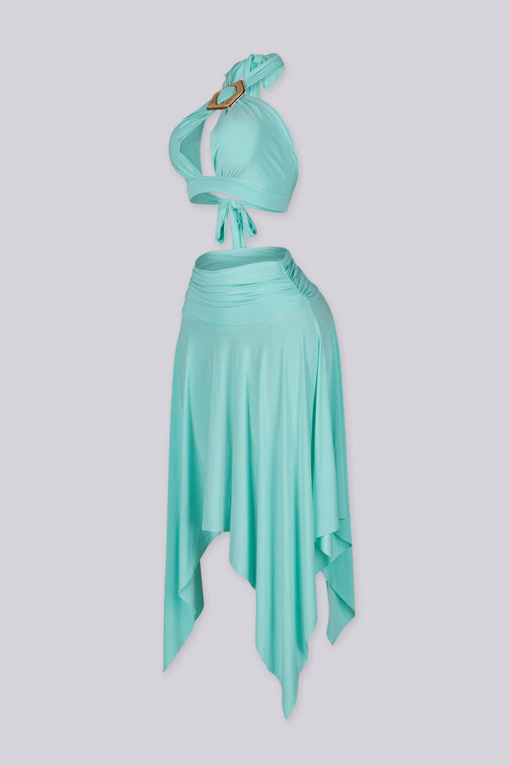 Halter bra top with sculptural metal trim and flowy pixie skirt with an asymmetrical hemline
