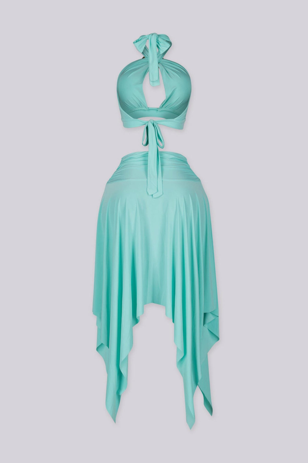 Halter bra top with sculptural metal trim and flowy pixie skirt with an asymmetrical hemline