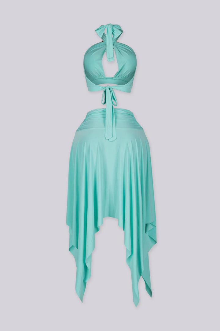 Halter bra top with sculptural metal trim and flowy pixie skirt with an asymmetrical hemline