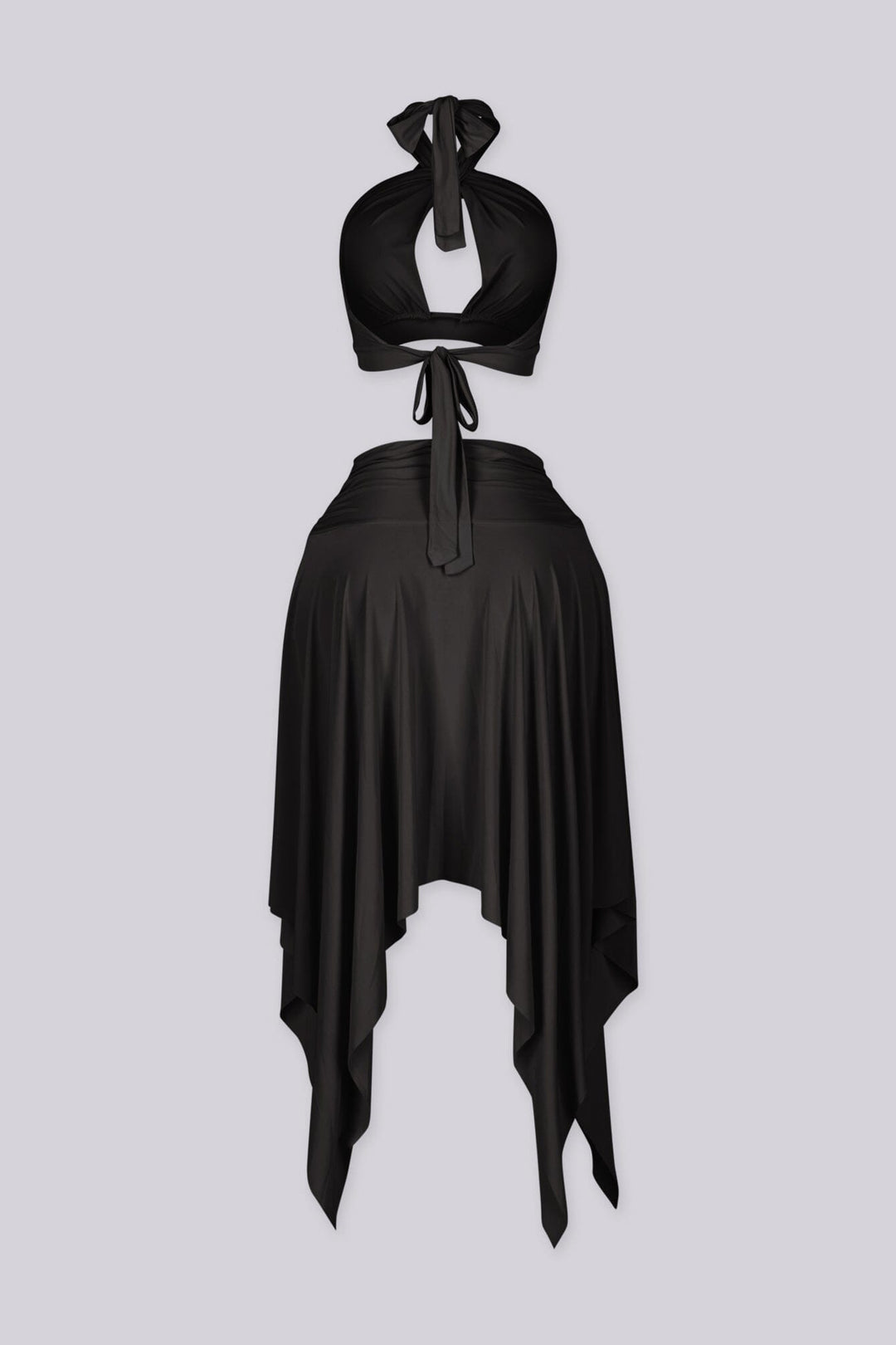 Halter bra top with sculptural metal trim and flowy pixie skirt with an asymmetrical hemline