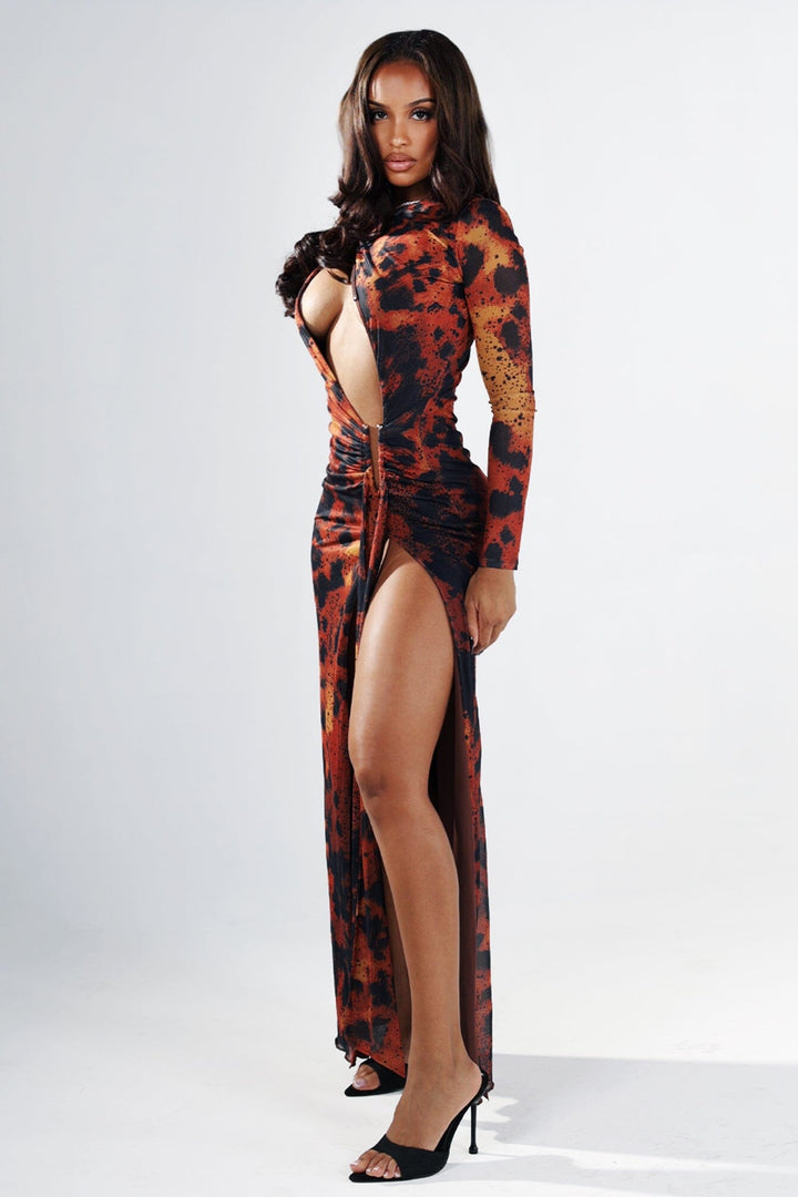 Leopard print long sleeve fitted maxi dress with round neckline featuring diagonal chest cutout and gathered waist with gold bar deatil