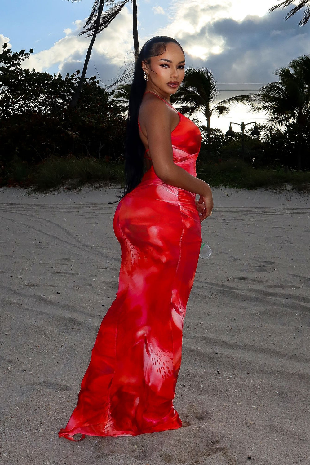 Padded halter maxi dress in abstract floral print
Ruched draping with crisscross open back detail
