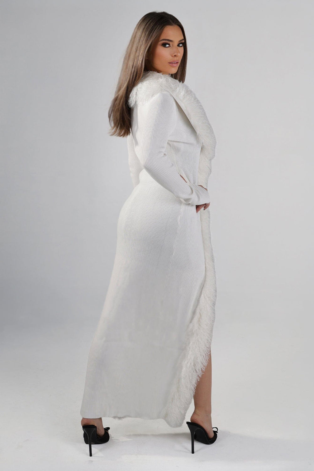 Maxi length ribbed knit sweater with oversized faux fur collar and trim down the front