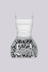 Fitted mini dress covered in oversized paillette sequins throughout with thin adjustable spaghetti straps