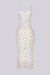 EDGE — ivory polka dot print midi dress with ruffle hem, three-quarter front view flat lay