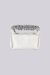 EDGE — ivory satin clutch with a crystal-embellished handle, front view flat lay