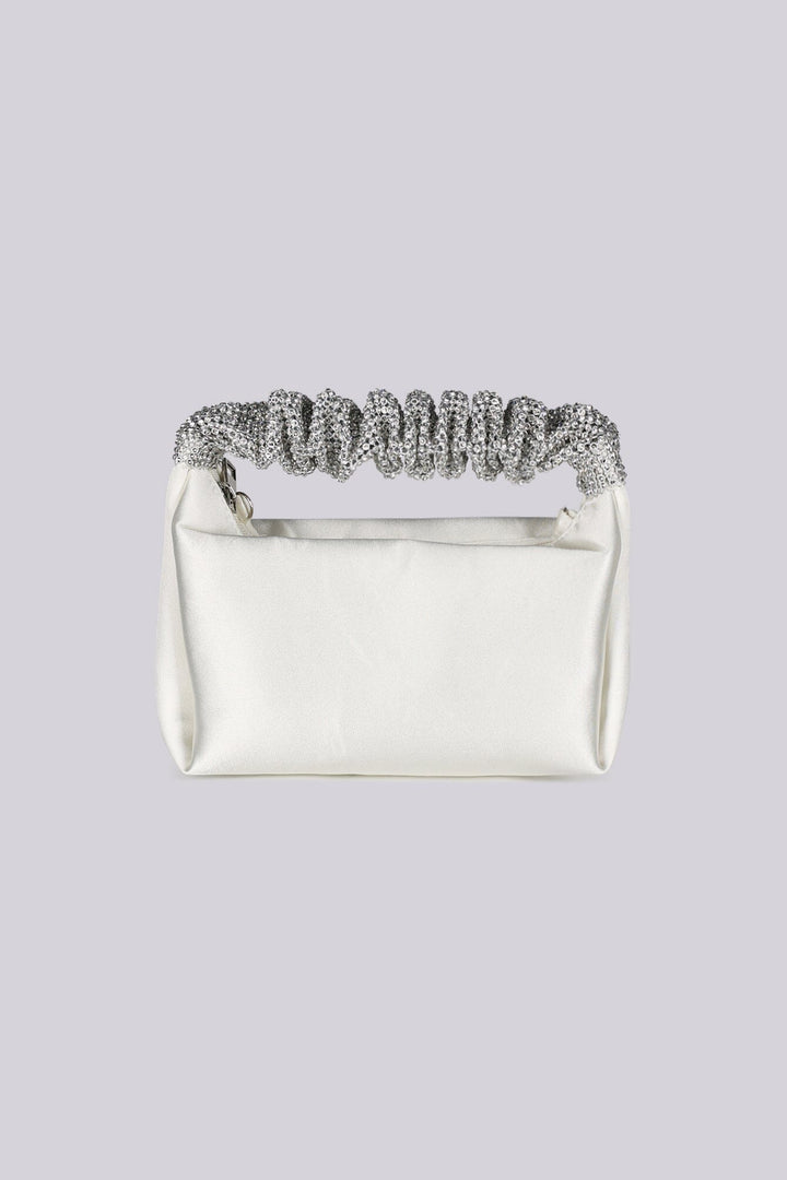 EDGE — ivory satin clutch with a crystal-embellished handle, front view flat lay