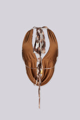 Deep plunging halter top with gold ring hardware at the center
