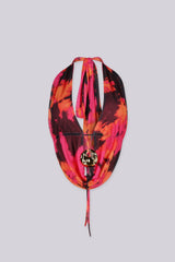 Deep plunging halter top with gold ring hardware at the center