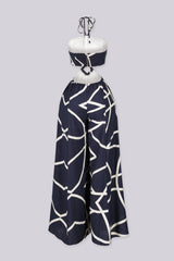 Linen abstract print wide leg halter jumpsuit featuring cutout waist with a square detail at the center