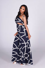 Linen abstract print wide leg halter jumpsuit featuring cutout waist with a square detail at the center