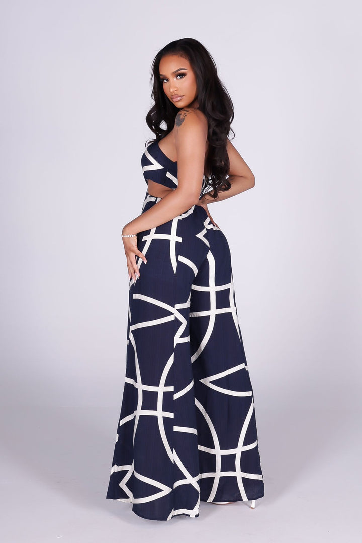 Linen abstract print wide leg halter jumpsuit featuring cutout waist with a square detail at the center