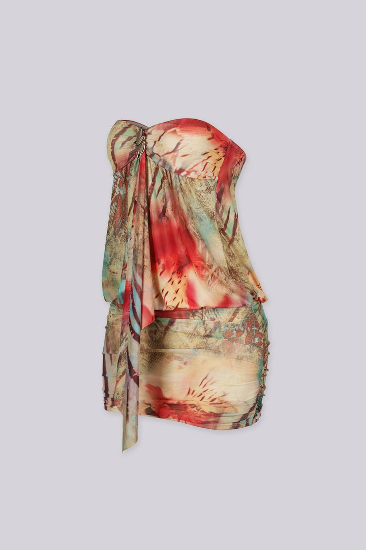 Abstract print tube mini dress featuring draped front detail with a metal accent and subtle volume through the waist