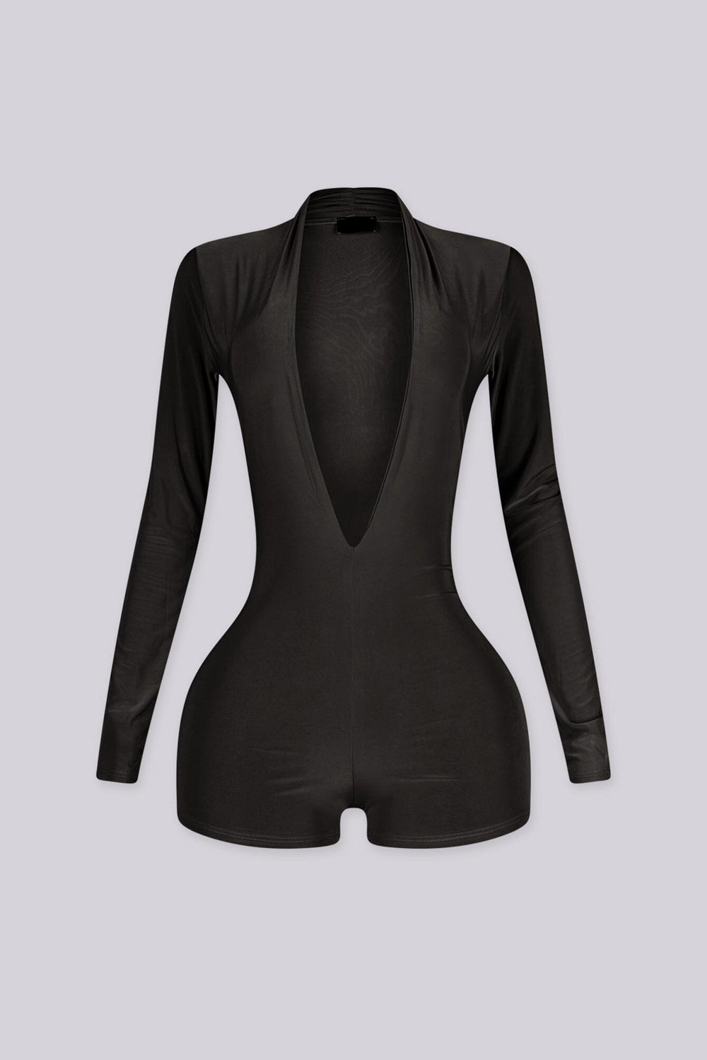 Long sleeve romper with fitted through the bodice and hip featuring deep plunging V neckline cuts down to the waist for a dramatic open front