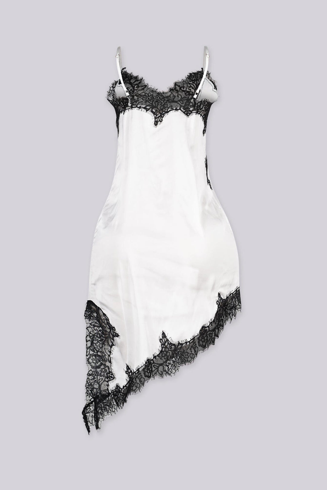 Asymmetrical hemline mini dress with v neckline and spaghetti straps featuring black lace trim