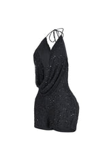 Deep plunging halter mini romper with draped cowl neck overlay and small strap connector featuring scatter shimmering beads