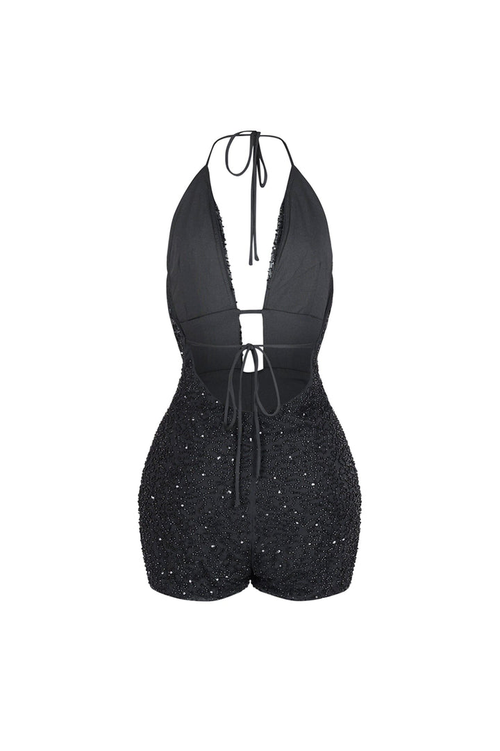 Deep plunging halter mini romper with draped cowl neck overlay and small strap connector featuring scatter shimmering beads