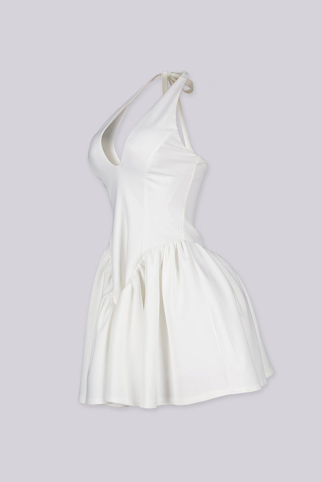 Fitted bodice halter neck mini dress with plunging v neckline featuring drop waist seams for flared swing hem