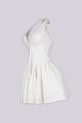 Fitted bodice halter neck mini dress with plunging v neckline featuring drop waist seams for flared swing hem