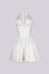 Fitted bodice halter neck mini dress with plunging v neckline featuring drop waist seams for flared swing hem