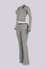 Ribbed knit fine striped halter neck tank top with long sleeves cropped bolero,
Matching flared pants with a fold over ribbed waistband