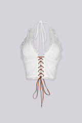 Halter neck suede lace-up top with deep V neckline
Adjustable open back design for a bold and fitted silhouette