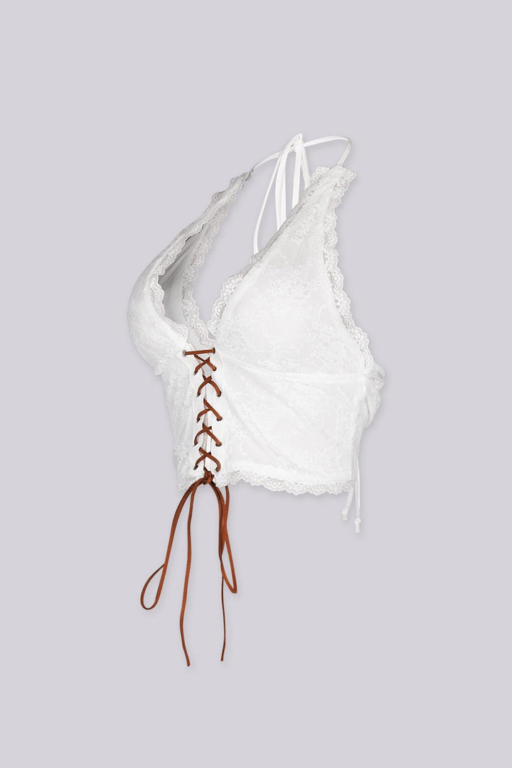 Halter neck suede lace-up top with deep V neckline
Adjustable open back design for a bold and fitted silhouette