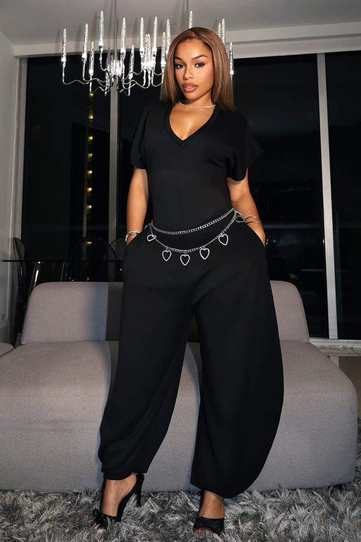 Relaxed fit jersey jumpsuit with deep V neckline and short dolman sleeves