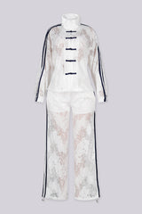 Sheer floral lace jacket with mandarin collar featuring full zip closure and frog knot button detailing at center front