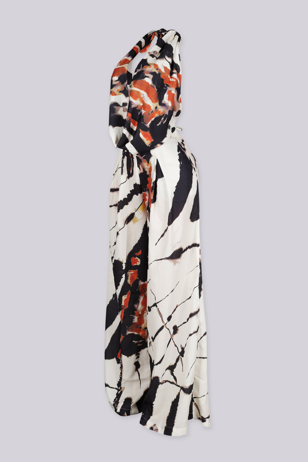 Marble printed halter neckline crop top with a deep V plunging cut to the waist
Adjustable tie back closure